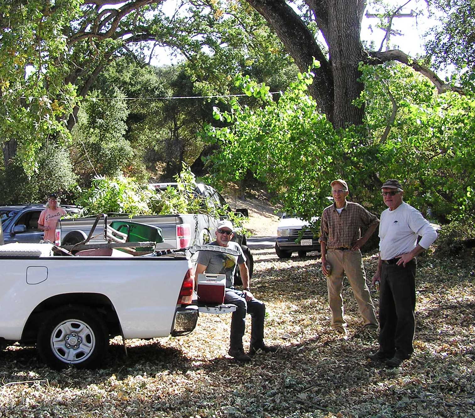 Trail Crew taking a break. One of the loads is in the pickup in the background.